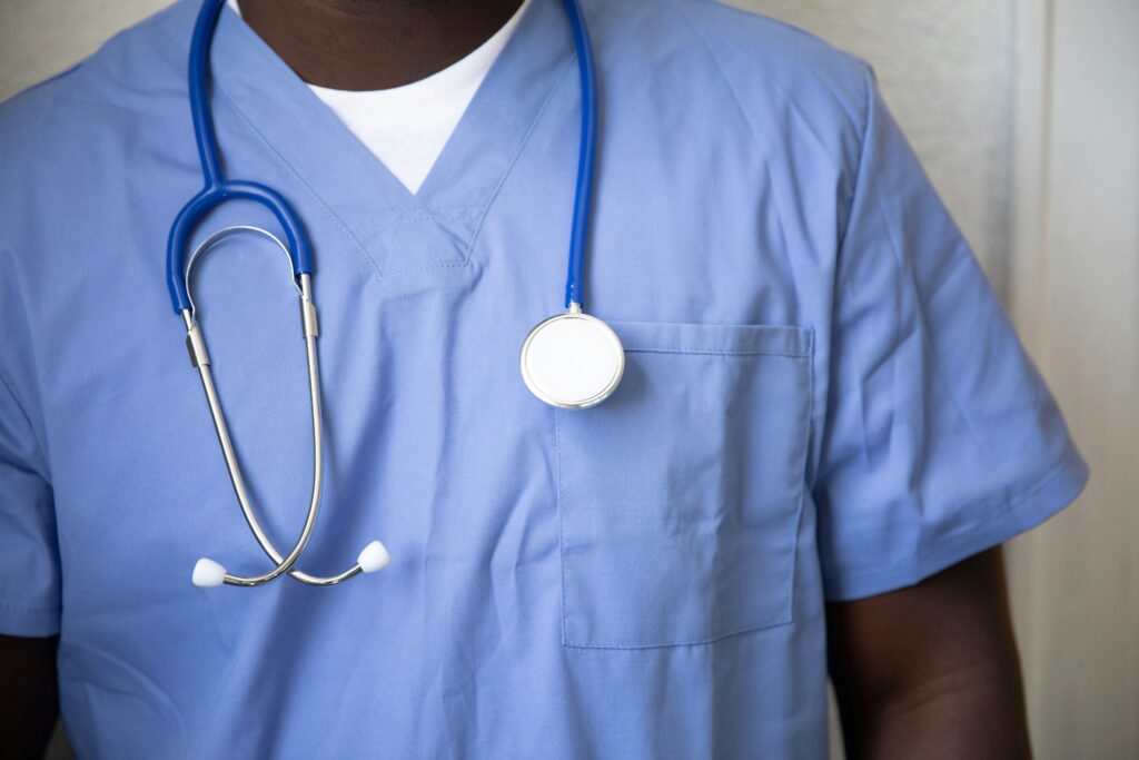 Healthcare professional in scrubs with a stethoscope for Texas medical practice formation